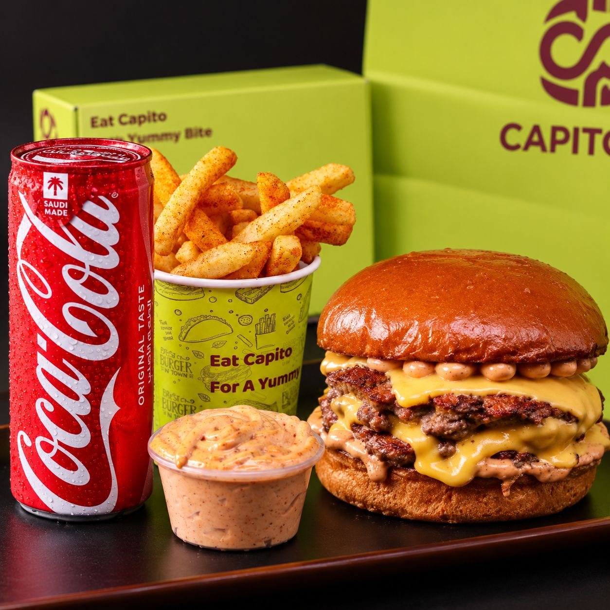 CP Triple Beef Burger, fries, sauce with drink.